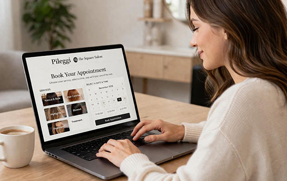 Woman booking a salon appointment online on her laptop